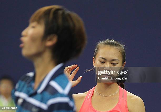 Shilin Xu of China reacts with Xiaodi You of China react during the doubles match against Gabriela Dabrowski of Canada and Alicja Rosolska of Poland...