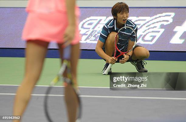 Xiaodi You of China reacts with Shilin Xu of China react during the doubles match against Gabriela Dabrowski of Canada and Alicja Rosolska of Poland...