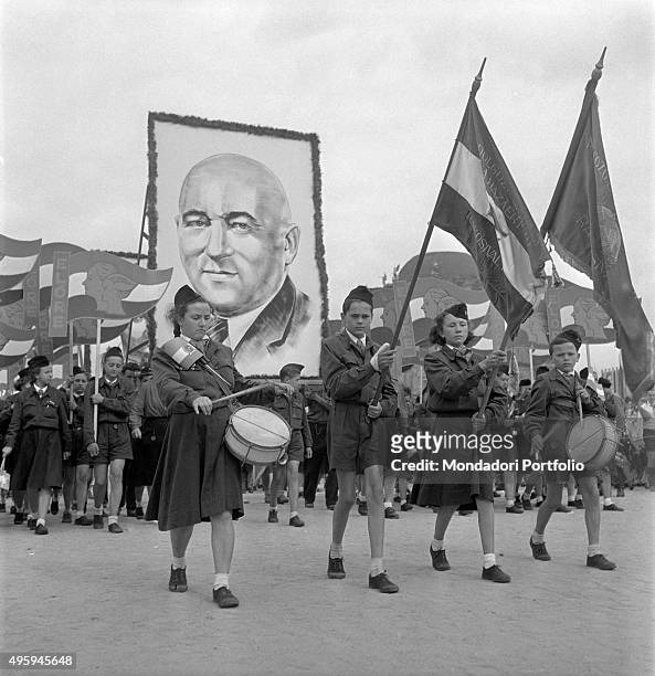 Young Ungarian people parading under the image of the Chairman of the Ungarian Communist Party Matyas Rakosi for the World Festival of Youth and...