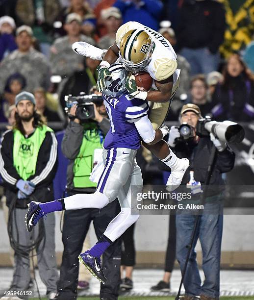 Wide receiver Corey Coleman of the Baylor Bears catches a touchdown pass over defensive back Duke Shelley of the Kansas State Wildcats during the...