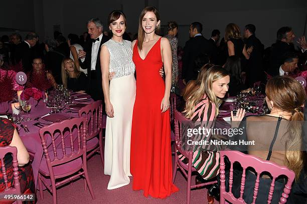 Dakota Johnson and Emily Blunt attend the 2015 Guggenheim International Gala Dinner made possible by Dior at Solomon R. Guggenheim Museum on November...