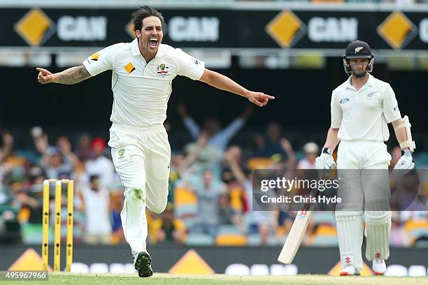 Mitchell Johnson of Australia celebrates after dismissing Ross Taylor of New Zealand during day two of the First Test match between Australia and New...