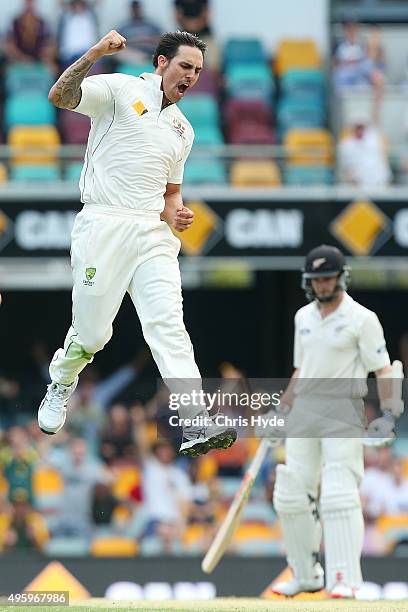 Mitchell Johnson of Australia celebrates after dismissing Ross Taylor of New Zealand during day two of the First Test match between Australia and New...