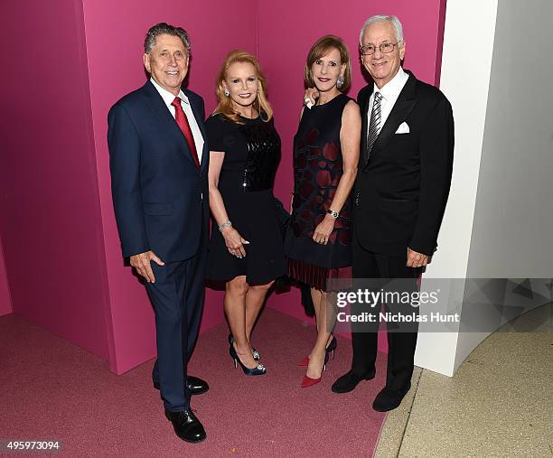 Robert Baker and Christine Baker pose with guests at the 2015 Guggenheim International Gala Dinner made possible by Dior at Solomon R. Guggenheim...