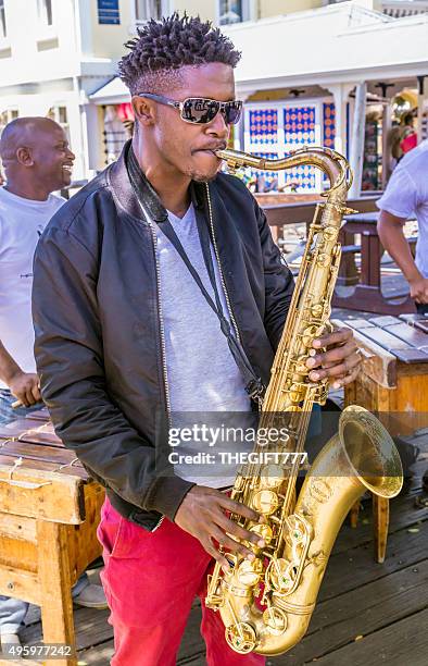 playing the saxophone at v& a waterfront, cape town - african music stock pictures, royalty-free photos & images