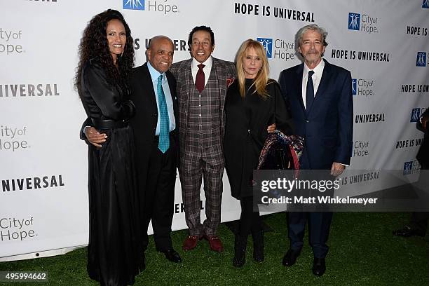 Eskadar Gobeze, record producer Berry Gordy, singer/songwriter Smokey Robinson, actress Rosanna Arquette, and Todd Morgan arrive at the City of...