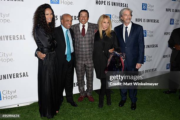 Eskedar Gobeze, record producer Berry Gordy, singer/songwrites Smokey Robinson, actress Rosanna Arquette, and Todd Morgan arrive at the City of...