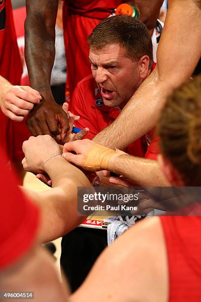 Trevor Gleeson, coach of the Wildcats addresses his players at a time-out during the round five NBL match between Perth Wildcats and Townsville...