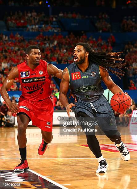 Jordair Jett of the Crocodiles looks to drive to the basket against Jermaine Beal of the Wildcats during the round five NBL match between Perth...