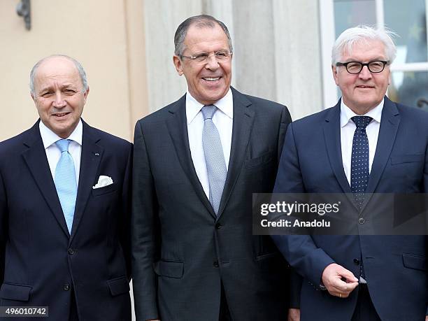 French Foreign Minister Laurent Fabius, Russian Foreign Minister Sergei Lavrov and German Foreign Minister Frank-Walter Steinmeier pose for a group...