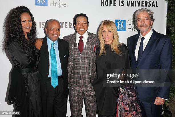 Eskedar Gobeze, record producer Berry Gordy, Jr., singer/songwriter Smokey Robinson, actress Rosanna Arquette and husband, Todd Morgan attend City Of...