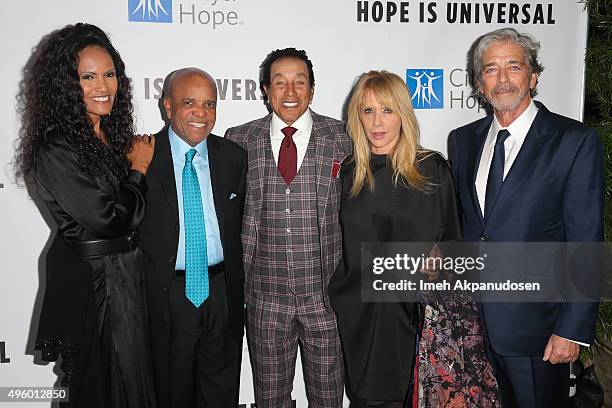 Eskedar Gobeze, record producer Berry Gordy, Jr., singer/songwriter Smokey Robinson, actress Rosanna Arquette and husband, Todd Morgan attend City Of...