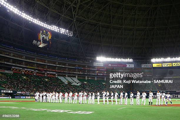 Japanese players line up for the national anthem prior to the send-off friendly match for WBSC Premier 12 between Japan and Puerto Rico at the...