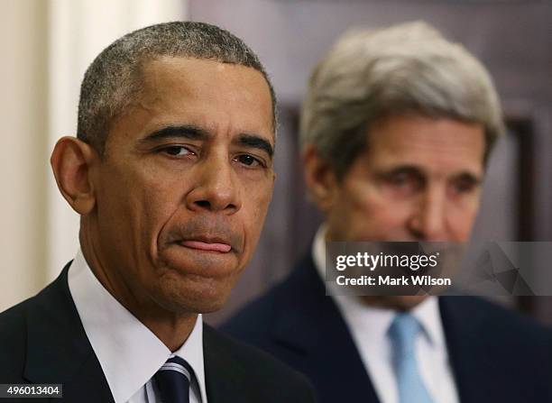 President Barack Obama, flanked by U.S. Secretary of State John Kerry , announces his decision to reject the Keystone XL pipeline proposal, at the...