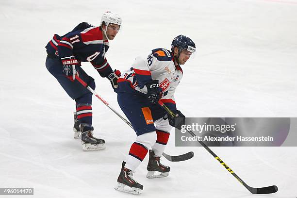 Ben Hanowski of the USA skates with Miroslav Preisinger of Slovakia during match 1 of the Deutschland Cup 2015 between USA and Slovakia at...
