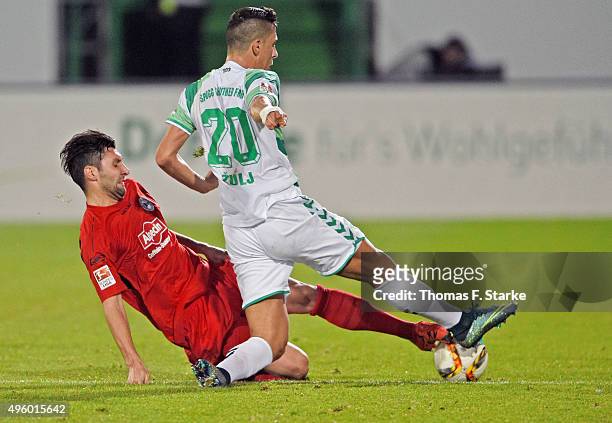 Stephan Salger of Bielefeld tackles Robert Zulj of Fuerth during the Second Bundesliga match between Greuther Fuerth and Arminia Bielefeld at Stadion...
