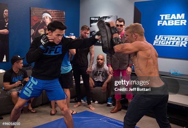 Thanh Le warms up with assistant coach TJ Dillashaw before facing Martin Svensson during the filming of The Ultimate Fighter: Team McGregor vs Team...