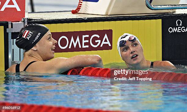 Katinka Hosszu, of Hungary and Lisa Zaiser after the finals finals of the women's 200 meter Individual Medley during day one of the FINA Swimming...