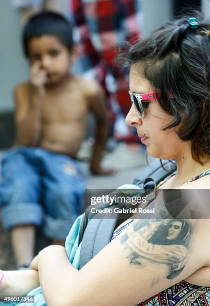 Tattoo of Nestor Kirchner and Cristina Kirchner is seen on the arm of a supporter during the inauguration of the second stage of the Scientific and...