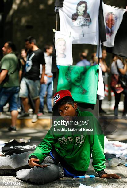 Child sits on the floor during the inauguration of the second stage of the Scientific and Technological Hub at CONICET on November 06, 2015 in Buenos...