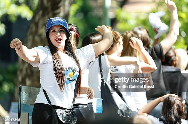 Supporter of President of Argentina Cristina Fernandez de Kirchner sings during the inauguration of the second stage of the Scientific and...