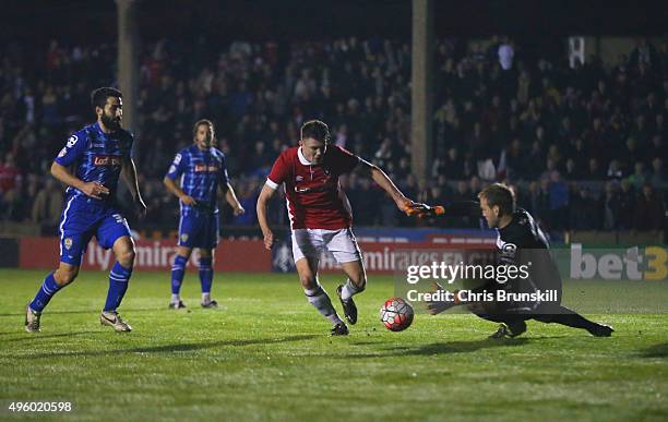 Jordan Hulme of Salford City takes on goalkeeper Roy Carroll of Notts County during the Emirates FA Cup first round match between Salford City and...