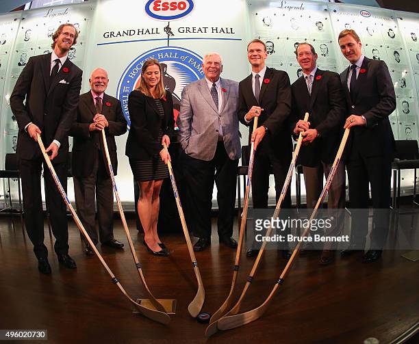 Chris Pronger, Peter Karmanos, Angela Ruggiero, Bill Hay, Nicklas Lidstrom, Phil Housley and Sergei Fedorov take part in a photo op at the Hockey...