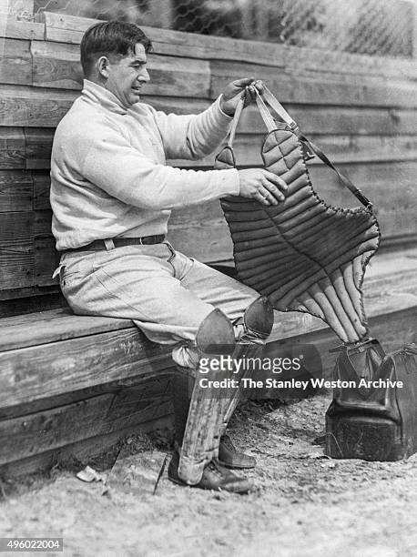 Roger Bresnahan of the New York Giants is preparing to take the field behind home plate as catcher, circa 1900.