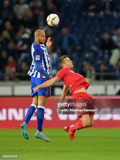 John Anthony Brooks of Hertha BSC and Artur Sobiech of Hannover 96 during the Bundesliga match between Hannover 96 and Hertha BSC at HDI-Arena on...