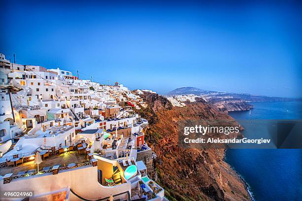 beautiful sunset view of fira, santorini, greece - firá stock pictures, royalty-free photos & images