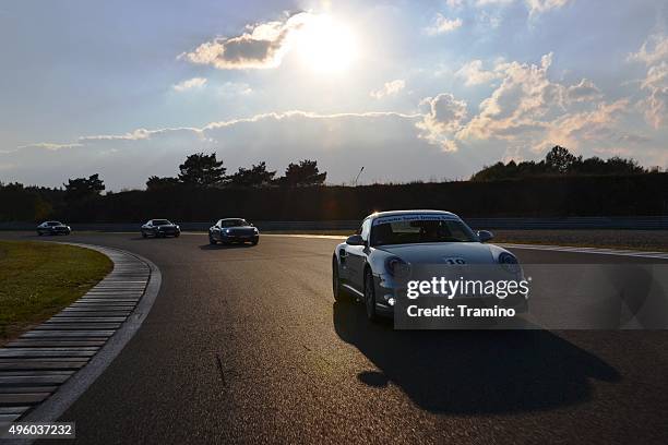 porsche 911 at the racetrack - supercar rally stock pictures, royalty-free photos & images