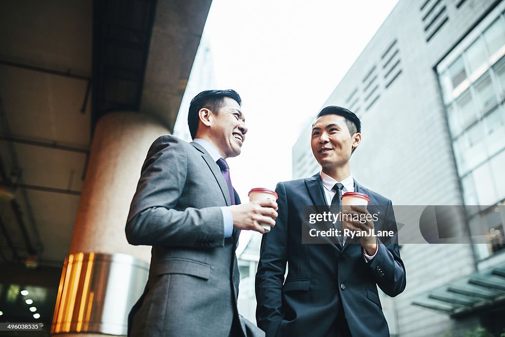 Asian Business Men Having Discussion