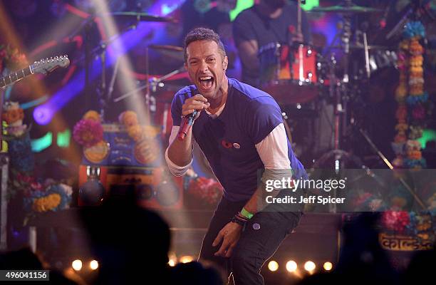 Chris Martin from Coldplay performs during a live broadcast of "TFI Friday" at the Cochrane Theatre on November 6, 2015 in London, England.