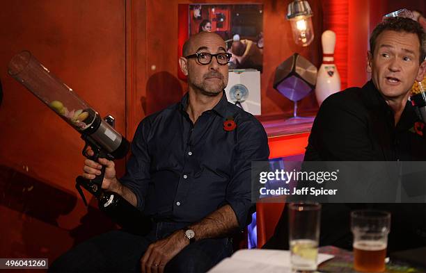 Stanley Tucci and Alexander Armstrong during a live broadcast of "TFI Friday" at the Cochrane Theatre on November 6, 2015 in London, England.