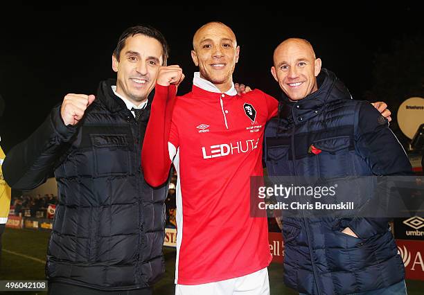Joint Salford City owners Gary Neville and Nicky Butt celebrate victory with goalscorer Richie Allen of Salford City after the Emirates FA Cup first...