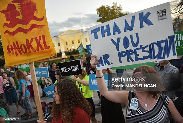 Activists, celebrating US President Barack Obama's blocking of the Keystone XL oil pipeline, rally in front of the White House in Washington, DC on...