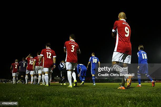 The two teams walk out ahead of the Emirates FA Cup First Round match between Salford City and Notts County at Moor Lane on November 06, 2015 in...