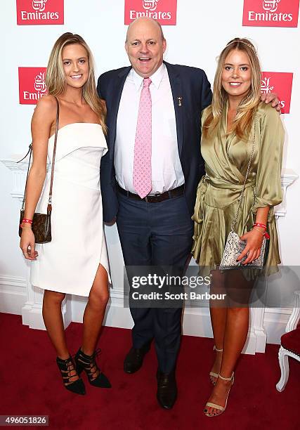 Billy Brownless and daughters Lucy Brownless and Ruby Brownless pose at the Emirates Marquee on Stakes Day at Flemington Racecourse on November 7,...