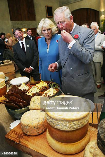 Prince Charles, Prince of Wales and Camilla, Duchess of Cornwall taste cheese at Mahana Winery on November 7, 2015 in Nelson, New Zealand. The Royal...