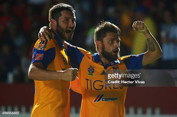 Rafael Sobis of Tigres celebrates with teammate Andre Gignac after scoring the third goal of his team during the 16th round match between Veracruz...