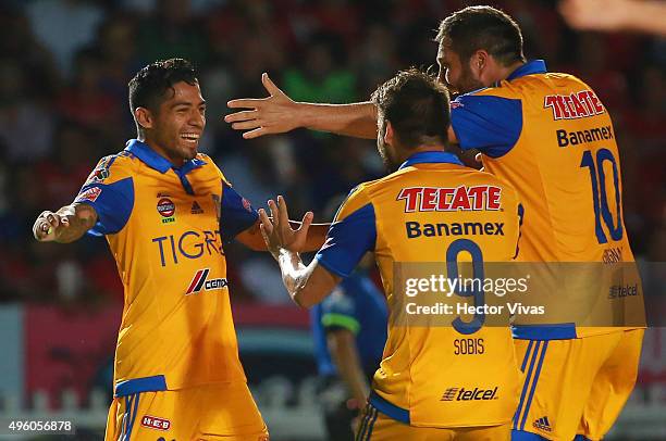 Javier Aquino of Tigres celebrates with teammates after scoring the second goal of his team during the 16th round match between Veracruz and Tigres...