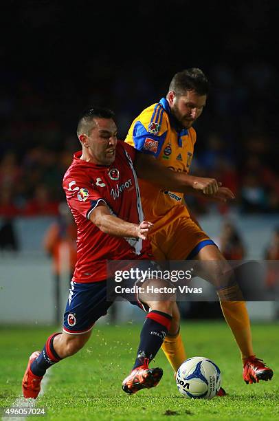 Andre Pierre Gignac of Tigres struggles for the ball with Fernando Meneses of Veracruz during the 16th round match between Veracruz and Tigres UANL...