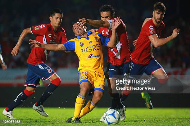 Egidio Arevalo of Tigres struggles for the ball with Leobardo Lopez of Veracruz during the 16th round match between Veracruz and Tigres UANL as part...
