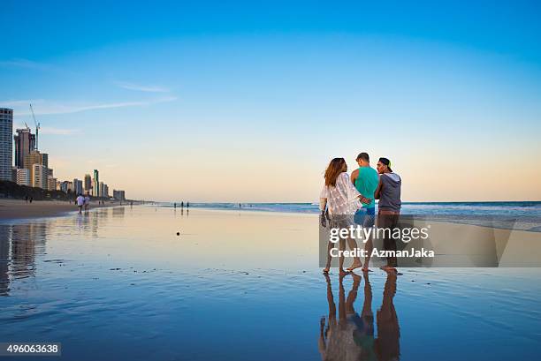 friends having fun at the beach - gold coast australia stock pictures, royalty-free photos & images