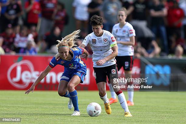 Gema Simon of the Jets is tackled by Keelin Winters of the Wanderers during the round four W-League match between the Newcastle Jets and the Western...