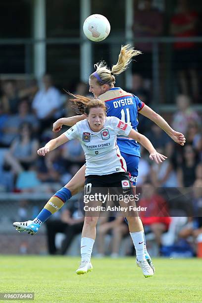Michelle Carney of the Wanderers contests the header against Ashlee Brodigan of the Jets during the round four W-League match between the Newcastle...