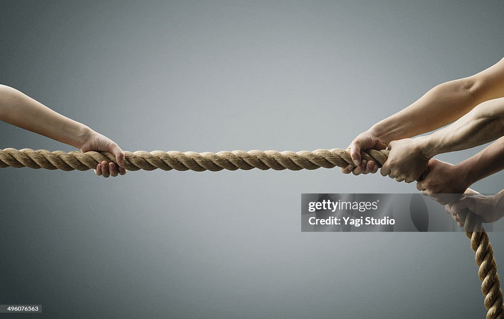 Hand each other pull the rope