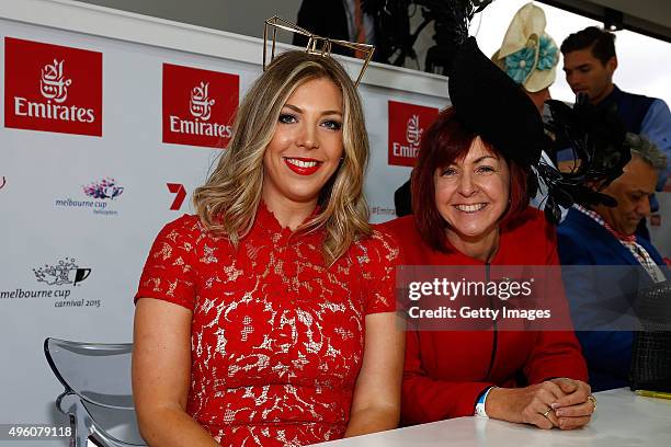 Fashion blogger Prue Chilcott and Milliner Kim Fletcher pose at the Emirates Fashions on the Field Marquee on Emirates Stakes Day at Flemington...