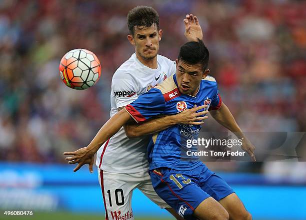 Kjie Lee of the Jets contests the ball with Dario Vidosic of the Wanderers during the round five A-League match between the Newcastle Jets and the...