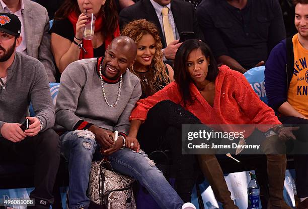 Floyd Mayweather Jr., Liza Hernandez and Regina King attend New York Knicks vs Milwaukee Bucks game at Madison Square Garden on November 6, 2015 in...